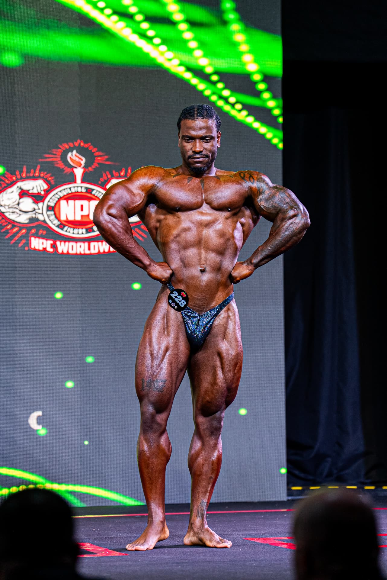 Pat posing on the competition stage